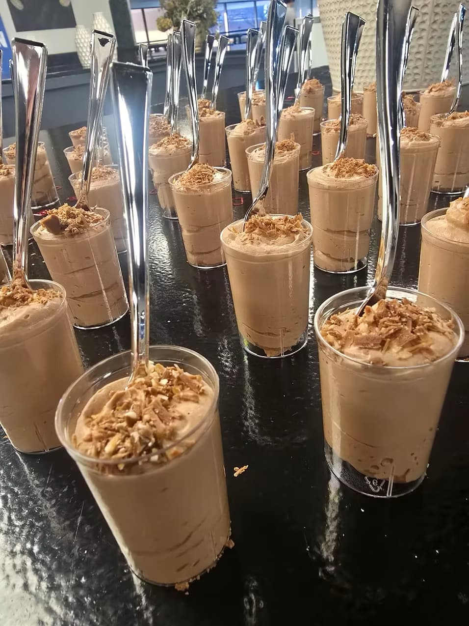 Individual dessert shooters prepared for an event