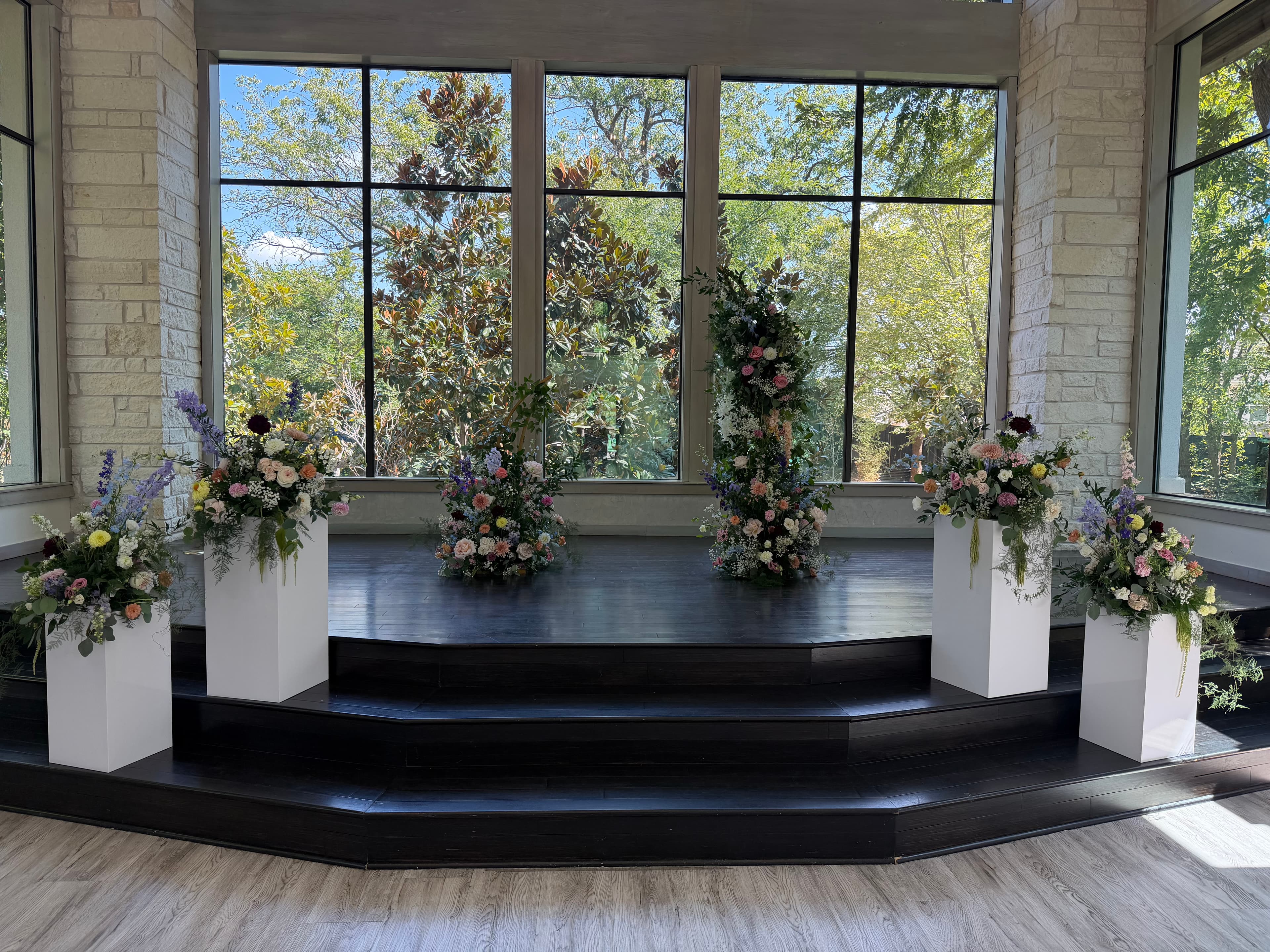 Wedding ceremony floral design by Occasions & Co.