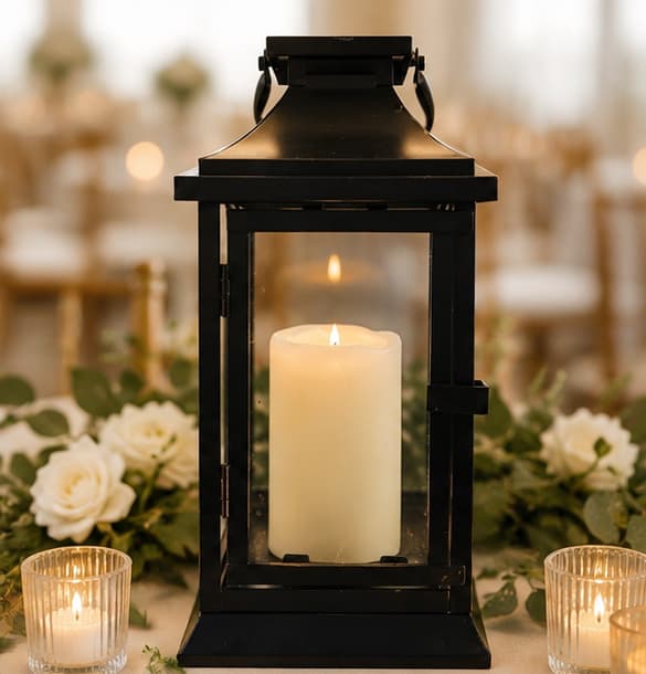 Black lantern rental styled with candlelight and florals
